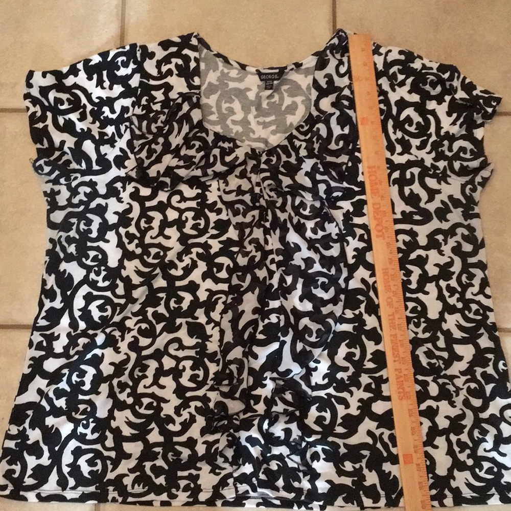 Black and white ruffle shirt.